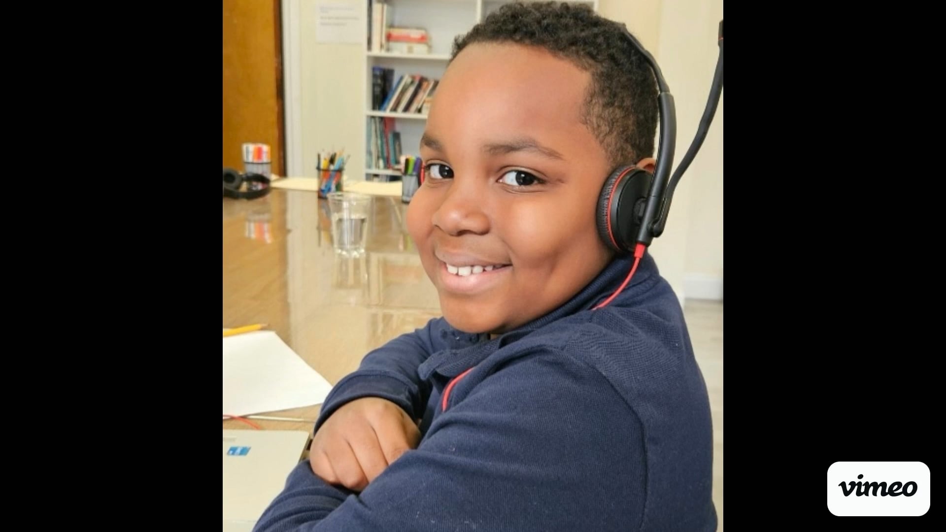 A Salt and Light student smiling while learning online